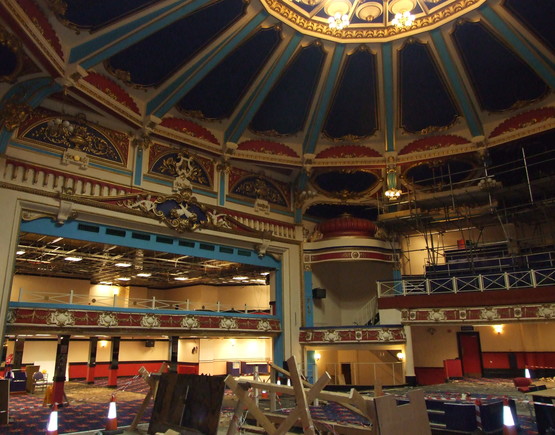 Auditorium of the derelict Brighton Hippodrome, showings its domed ceiling and ornate plasterwork.