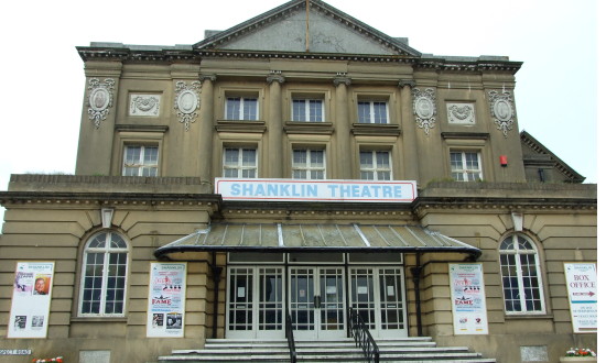 Exterior of Shanklin Theatre, a grand stone building with stairs leading up to the front entrance.