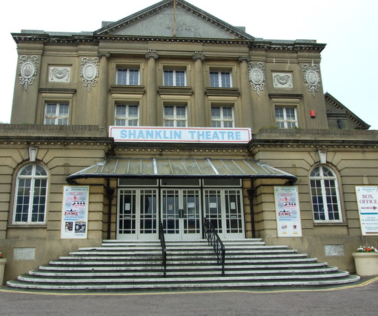 Exterior of Shanklin Theatre, a grand stone building with stairs leading up to the front entrance.