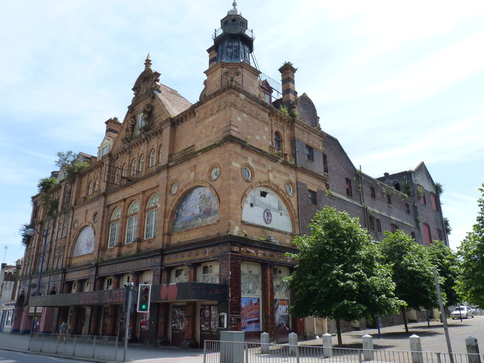 Corner photo of Plymouth Palace with its art nouveau armada tiles adorning the facade. 