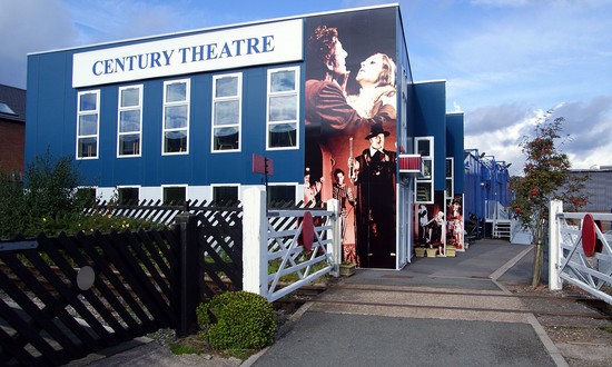 The blue exterior of the Century Theatre.