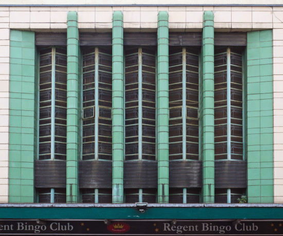 Green and white art deco frontage of former theatre in use as a bingo hall