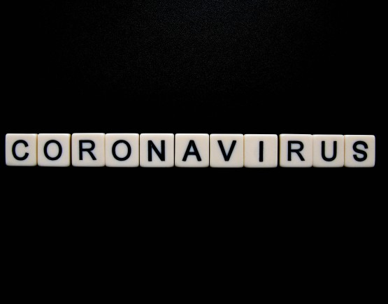 The word 'Coronavirus' displayed using pieces from the board game Scrabble.