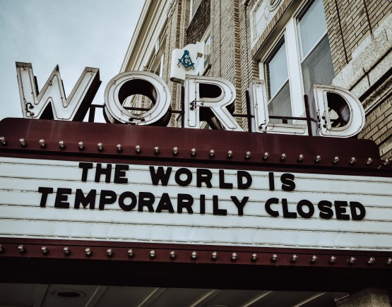 World cinema signage reading The World is Temporarily Closed