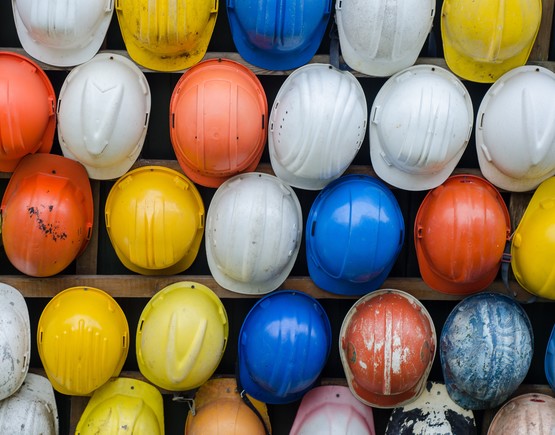 Collection of hard hats in a variety of colours