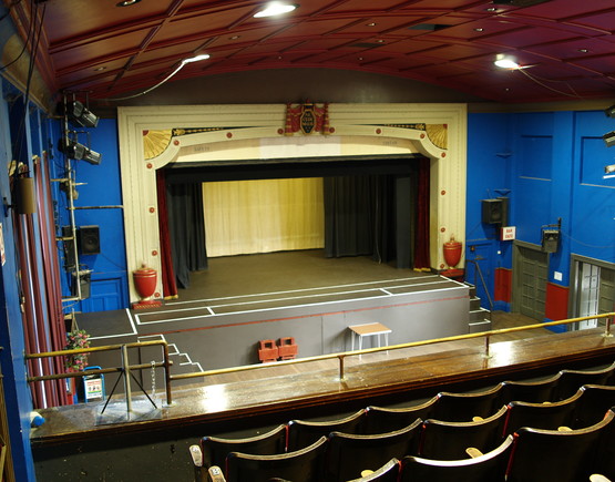 A view from the back of the raked stalls to the end stage of Intimate Theatre.