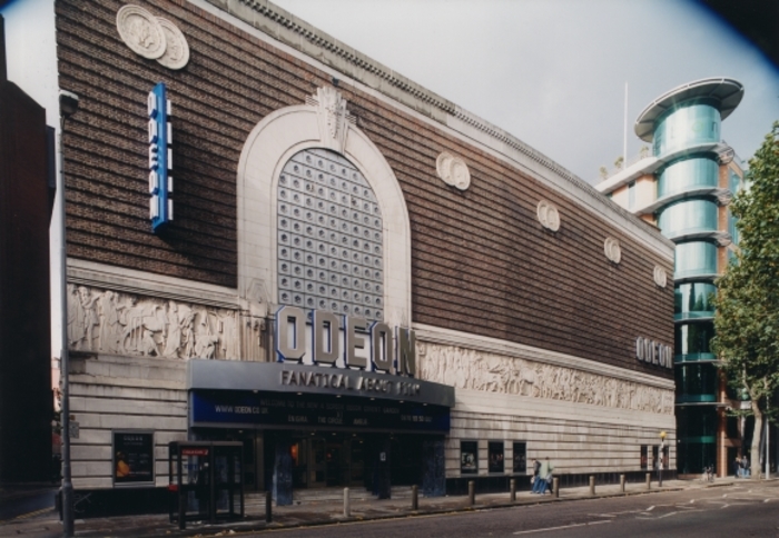Exterior of Odeon Covent Garden with signage and frieze.