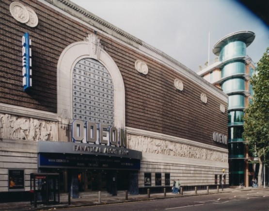 Exterior of Odeon Covent Garden with signage and frieze.