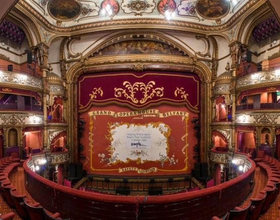 Historic auditorium of the Grand Opera House Belfast with safety curtain, viewed from the circle.