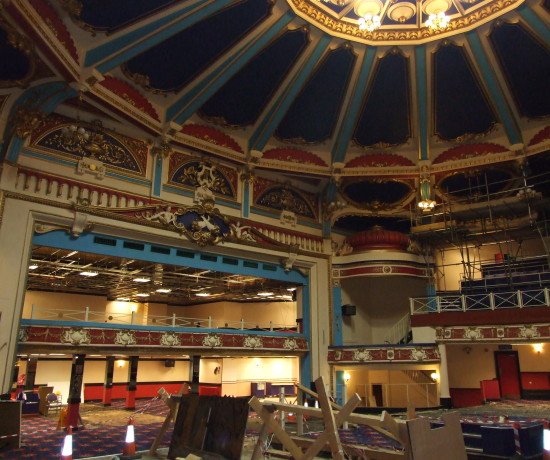Auditorium of the derelict Brighton Hippodrome, showings its domed ceiling and ornate plasterwork.