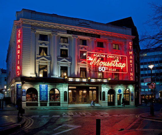 Exterior of St Martins Theatre at night with signage for the Mousetrap