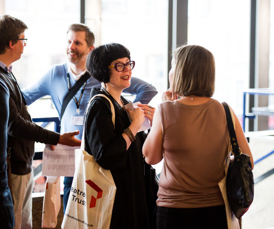 A group of people chatting amongst themselves at the Theatres Trust Conference in 2016