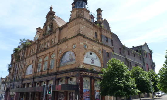 Corner photo of Plymouth Palace with its art nouveau armada tiles adorning the facade. 