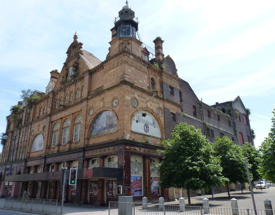 Corner photo of Plymouth Palace with its art nouveau armada tiles adorning the facade. 