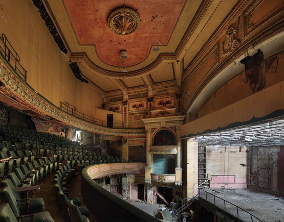 Colour auditorium photo from the first balcony looking across to the opposite side boxes and up to the ceiling. 