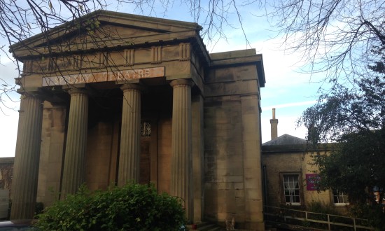 The exterior of Spilsby Theatre set in tree-lined grounds.