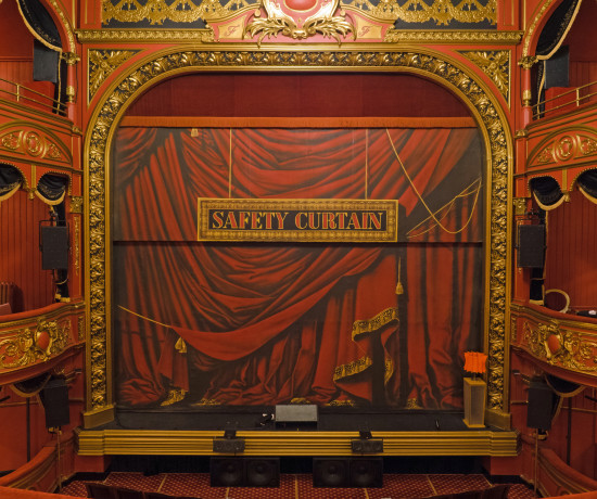 Safety curtain on the stage at Theatre Royal Stratford East