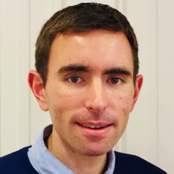 Headshot of Tom Clarke