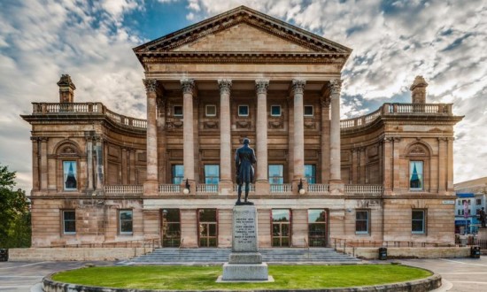 Exterior photo of Paisley Town Hall in the day time, with grass in the foreground.