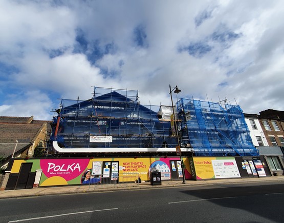 Exterior of Polka Children's Theatre covered in scaffolding