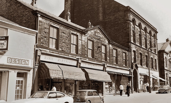 Sepia streetscape postcard of Ramsbottom Co-op Hall