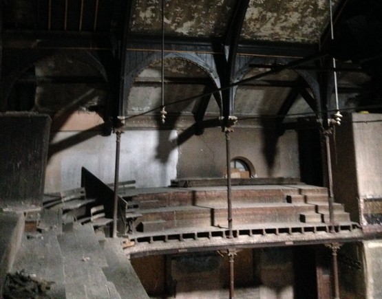 View across the balcony with its iron columns and wooden ceiling at Ramsbottom Co-op Hall