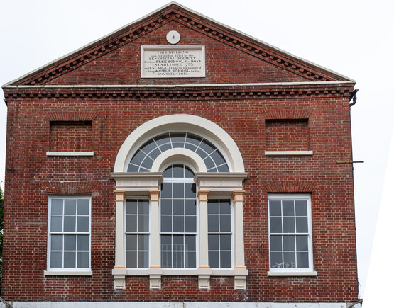A façade of the theatre, showing the upper floor window.