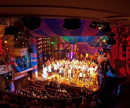 West End production of Hair with a busy audience