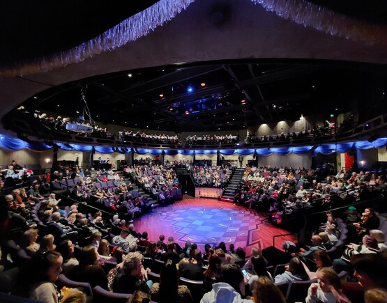 Theatre in the round with a full audience