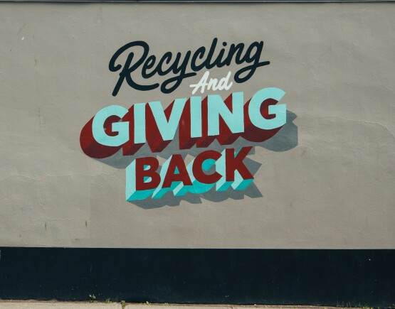 Recycle and Give Back painted on a wall