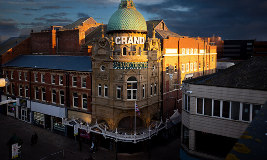Exterior of Blackpool Grand Theatre with an illuminated sign
