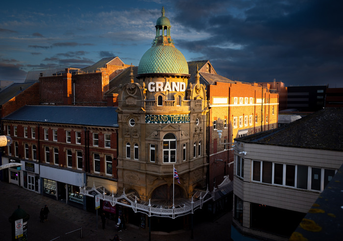 Exterior of Blackpool Grand Theatre with an illuminated sign