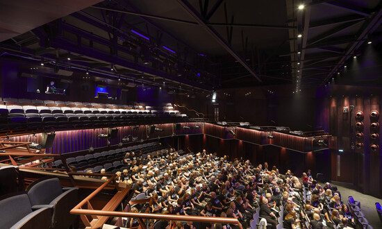 Audience in auditorium of BEAM